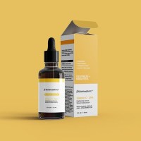 SkinHealthMD Vitamin C 20% Serum Dropper Bottle and Packaging on a Yellow ackground